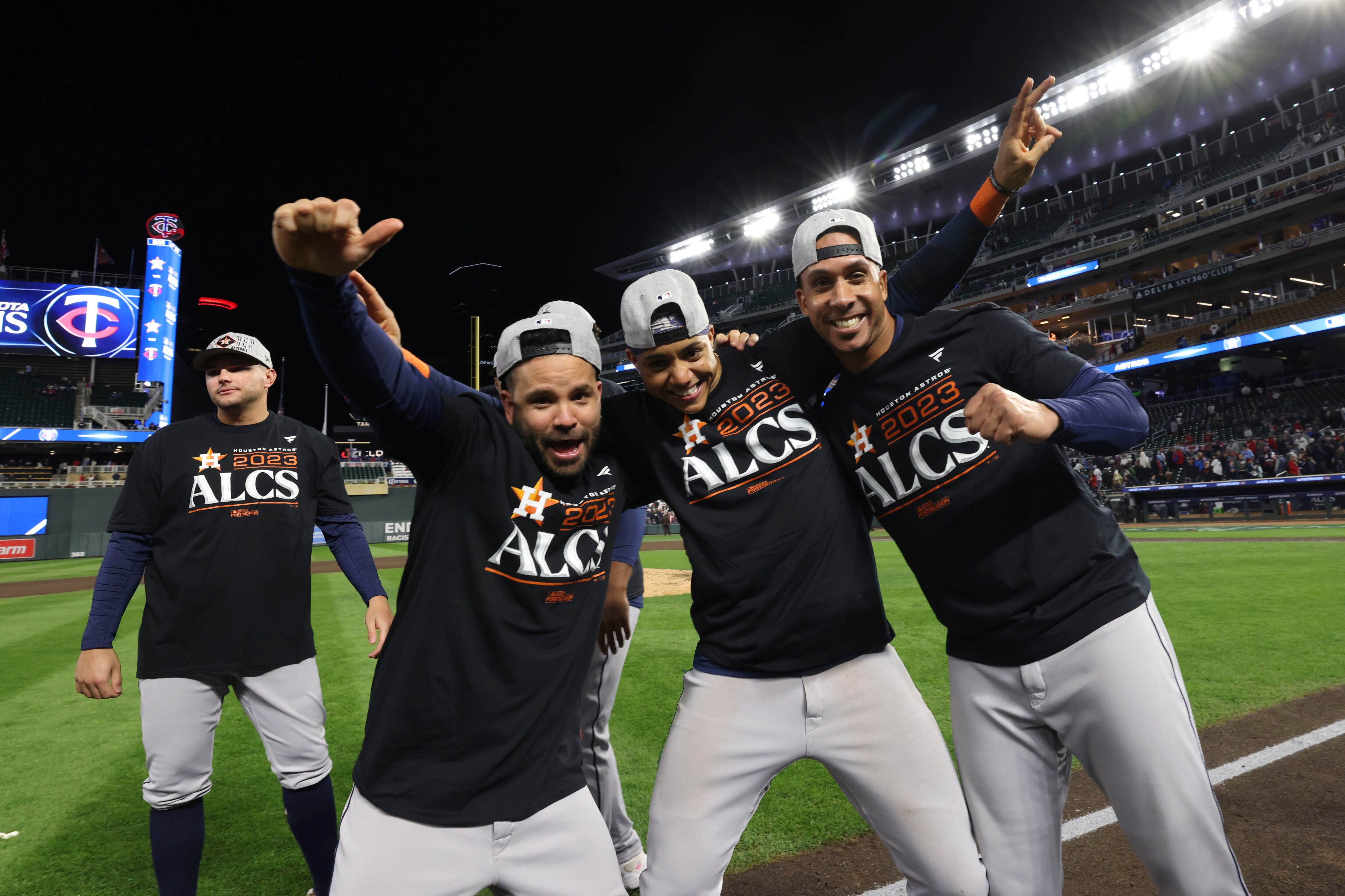 Houston Astros fan holding up Go Chris signs for Houston Astros