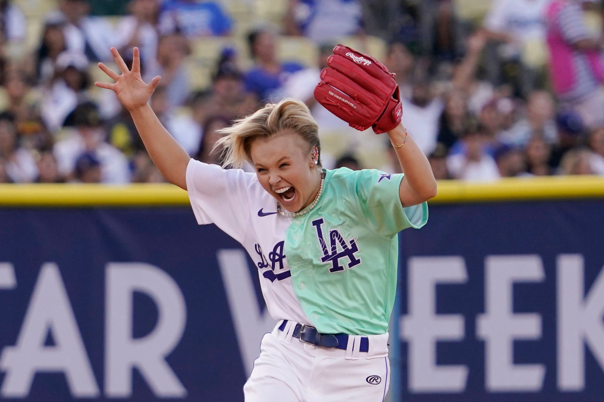 Rapper and singer Bad Bunny runs in the outfield during the MLB All Star  Celebrity Softball game, Saturday, July 16, 2022, in Los Angeles. (AP  Photo/Mark J. Terrill)