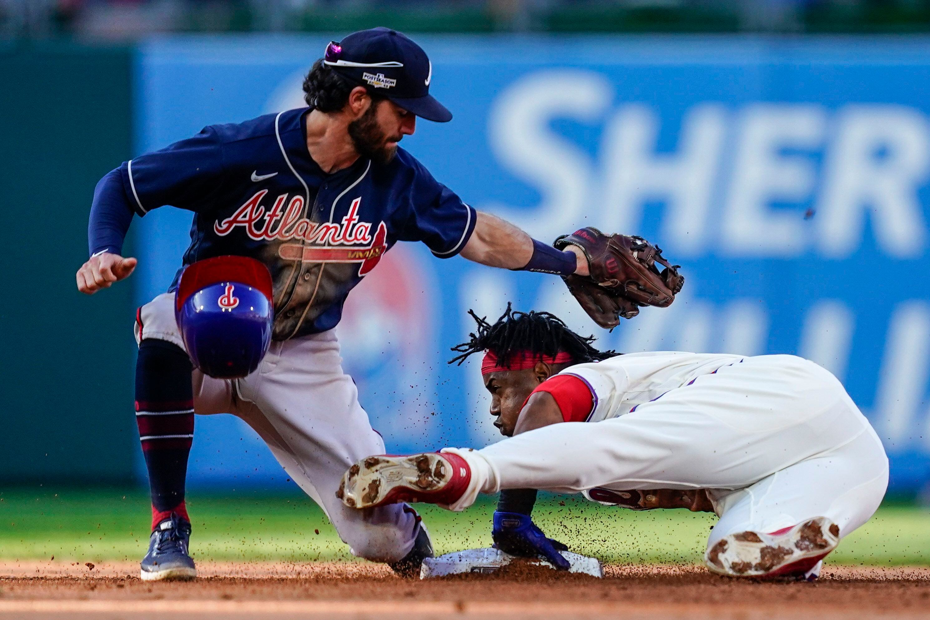 ATLANTA, GA - JULY 30: Atlanta Braves second baseman Orlando Arcia (11)  looks on tfrom the dugout during the Saturday evening MLB game between the  Atlanta Braves and the Arizona Diamondbacks on