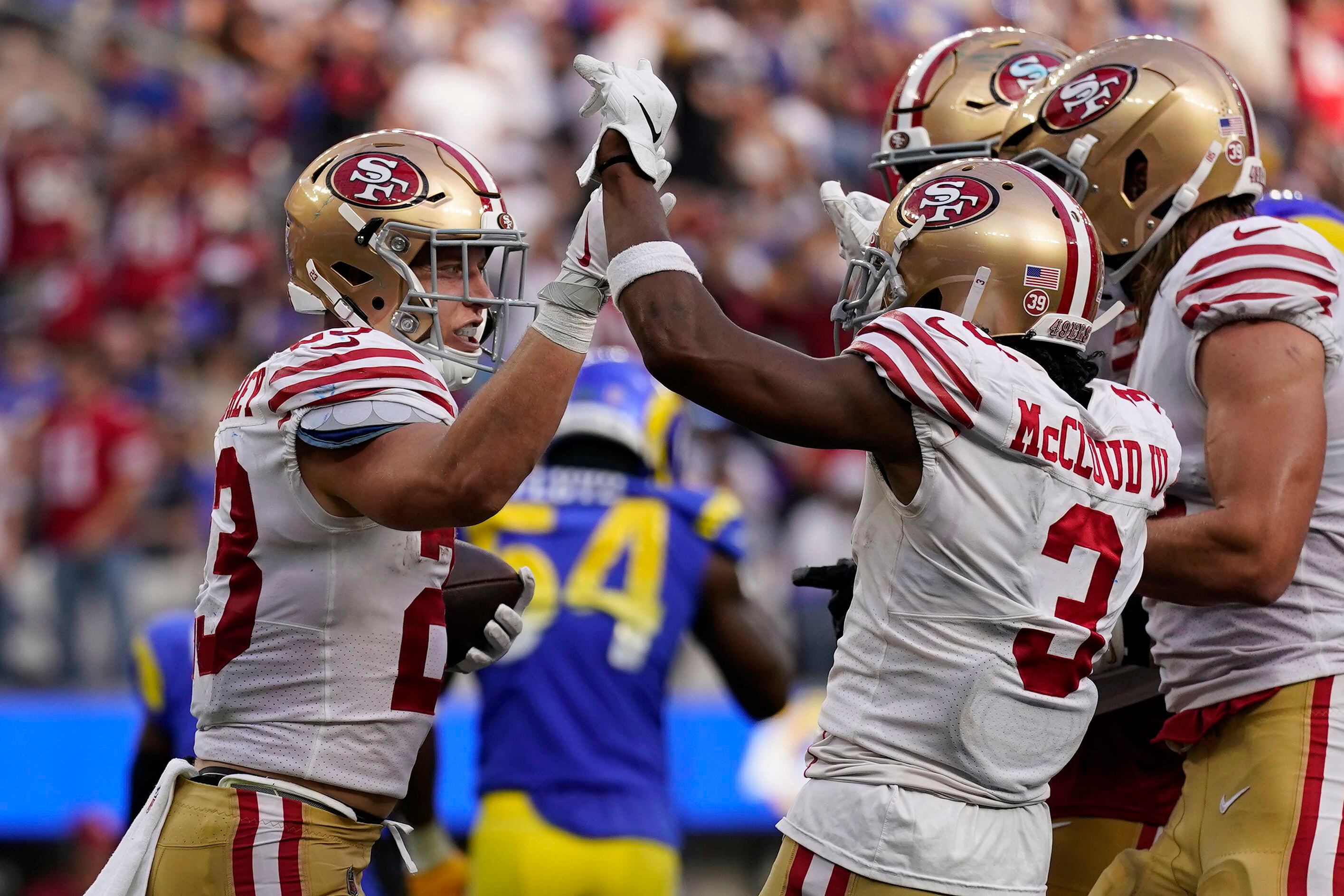 McCaffrey throws, catches, rushes for TDs, Niners rout Rams – KXAN Austin