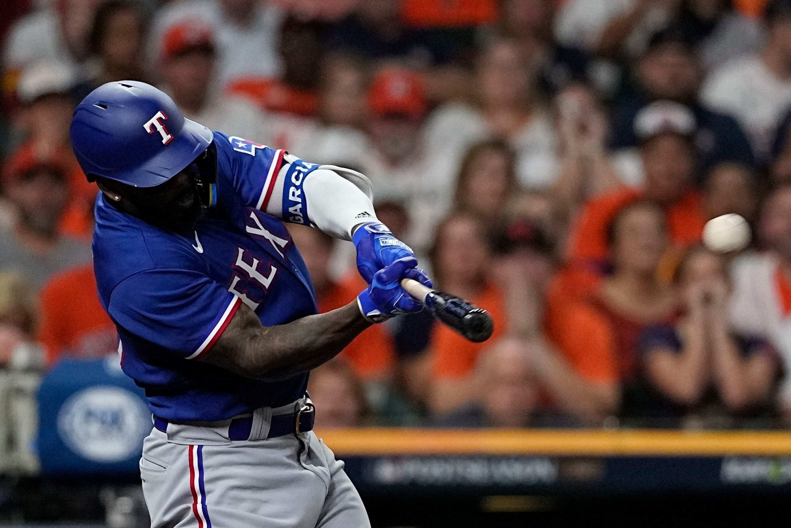 Rangers' Jonah Heim exits game vs. Astros after awkward swing