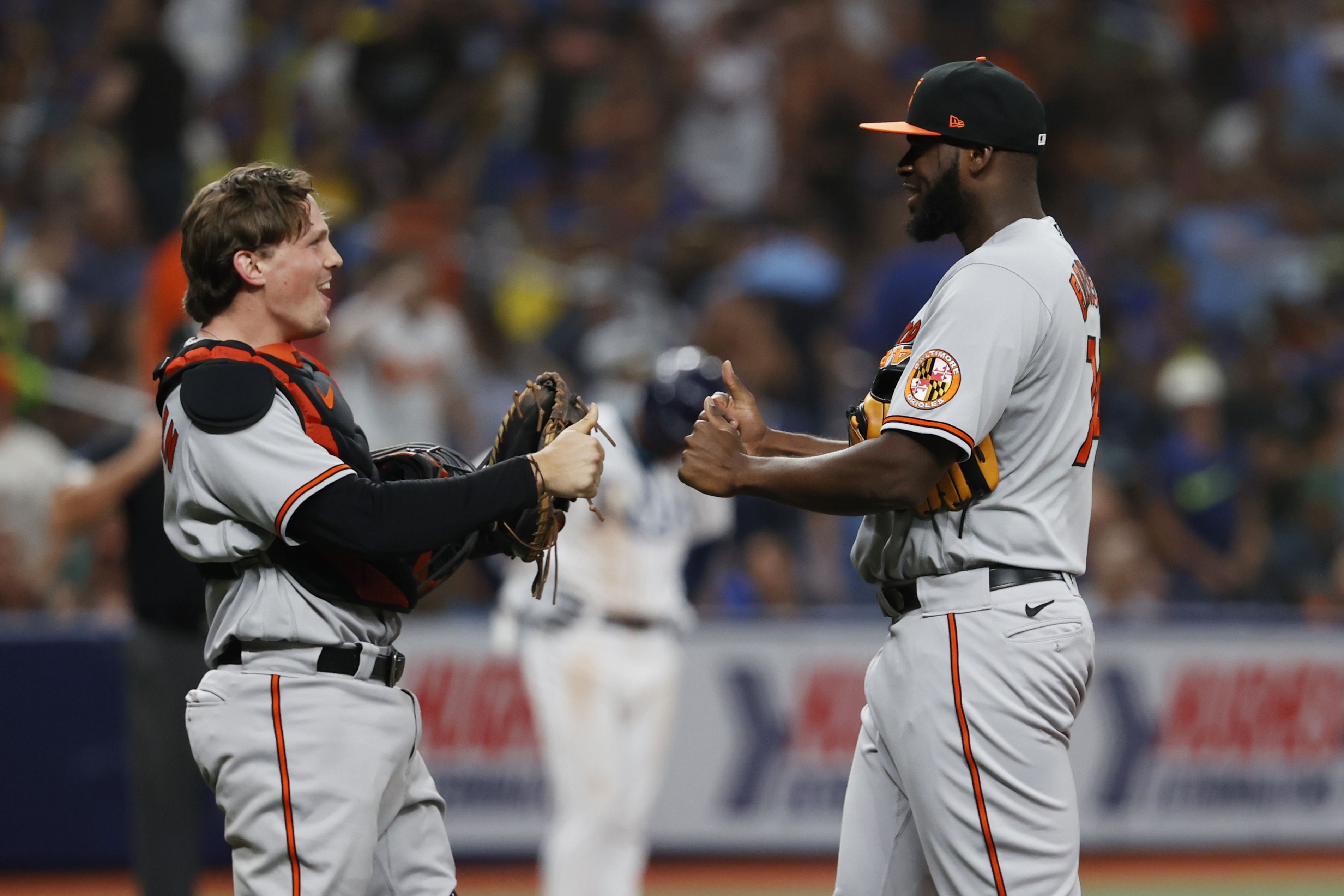 Adam Frazier of the Baltimore Orioles throws the ball to first