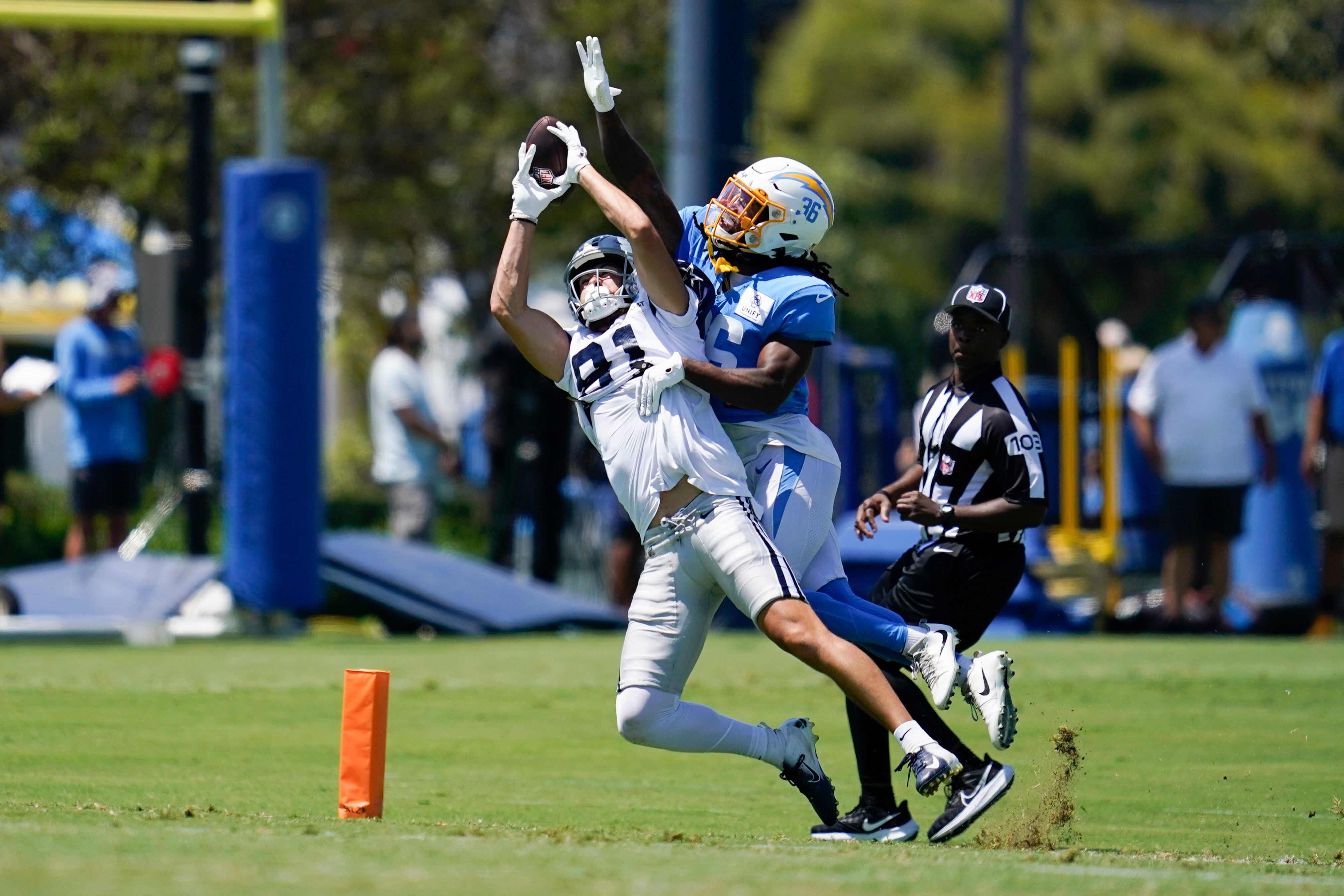 Los Angeles Rams wide receiver Tyler Johnson (14) reaches for the pass  while being held by Los Angeles Chargers cornerback AJ Uzodinma (35) in a  NFL preseason game. The Chargers defeated the