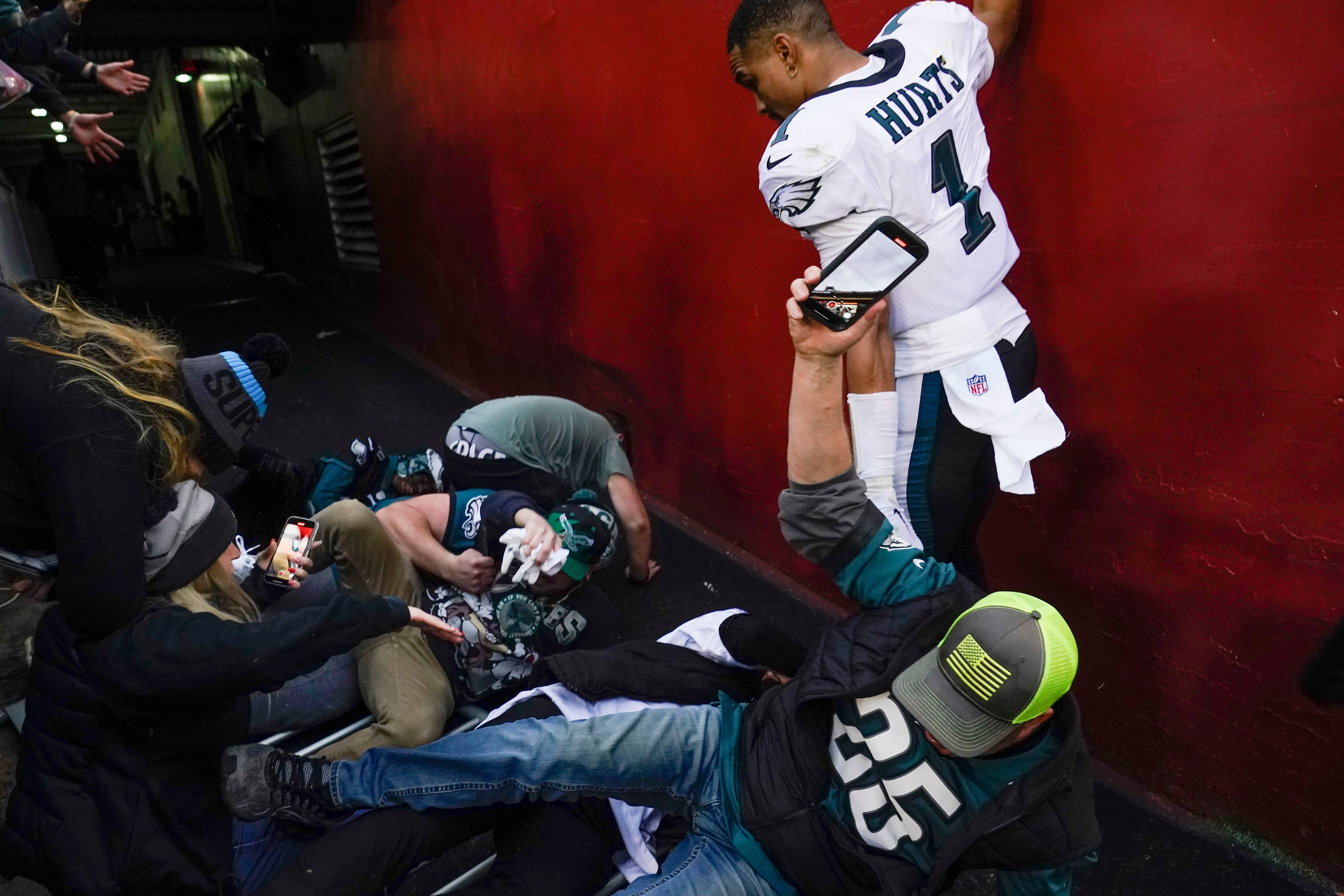 Hurts OK after railing collapse, Eagles beat Washington