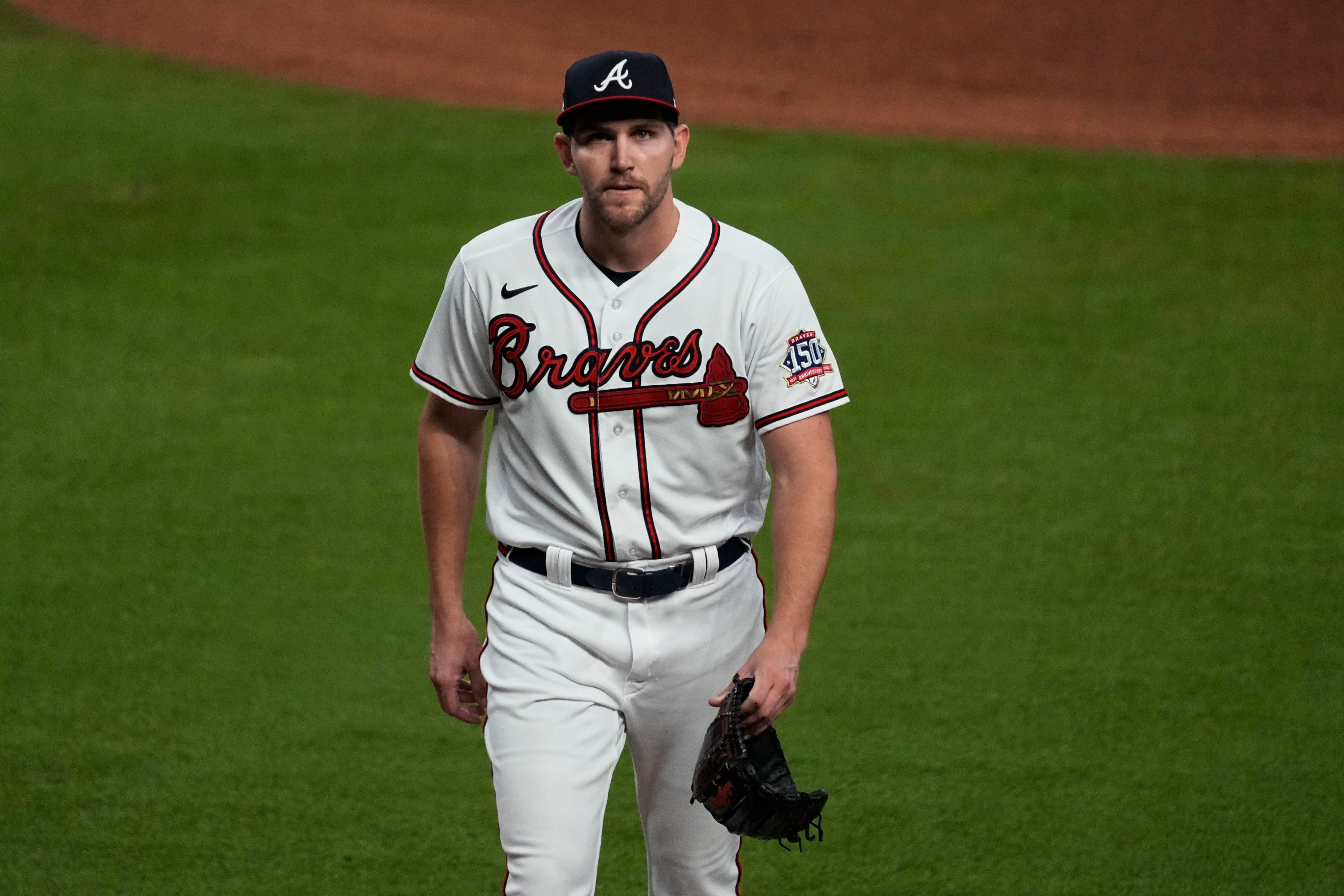 Atlanta Braves Marquis Grissom is tagged out at home plate by