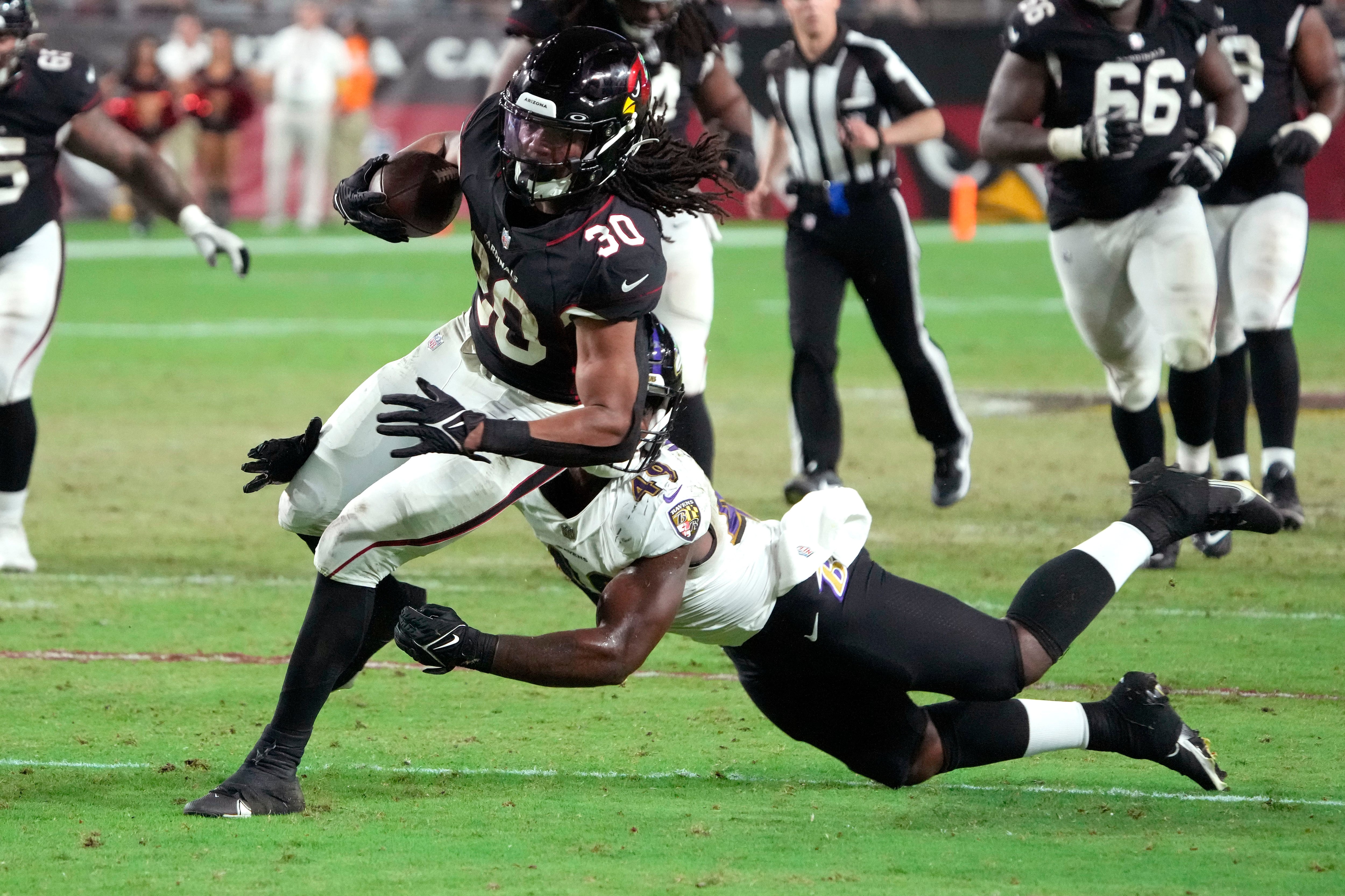 Running back (30) Tyler Badie of the Baltimore Ravens catches a