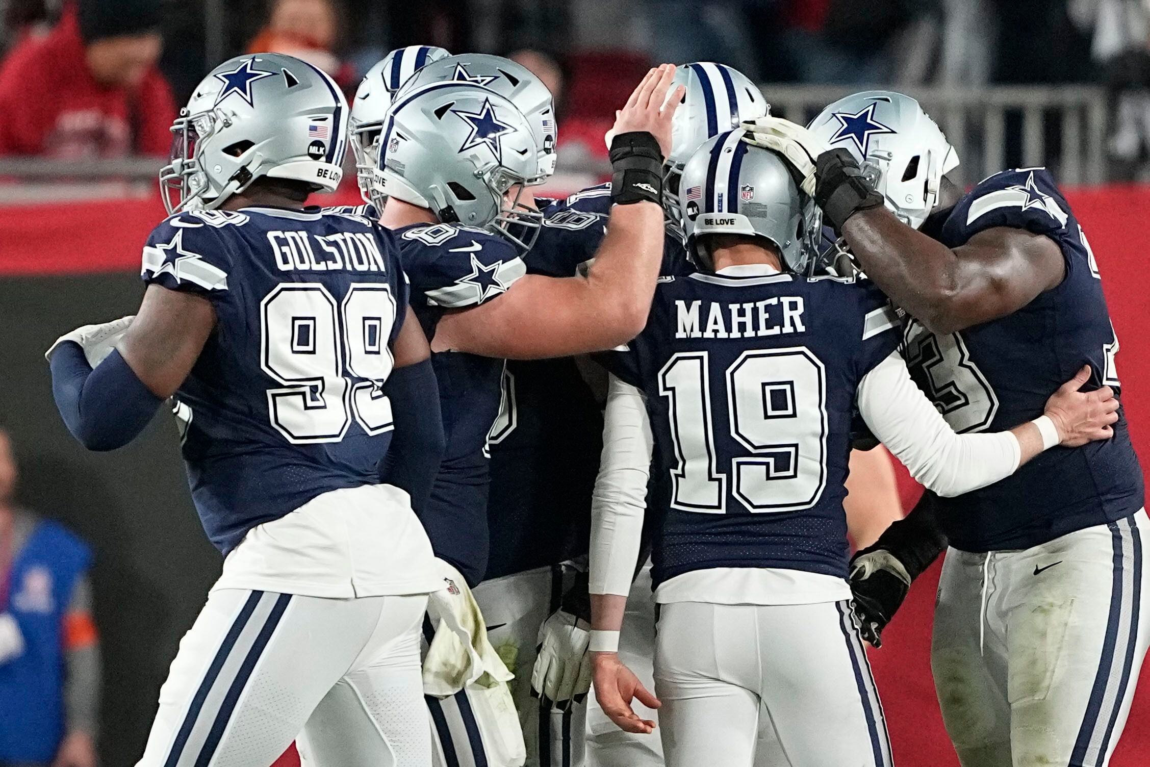 Dallas Cowboys linebacker Micah Parsons (11) and wide receiver CeeDee Lamb  (88) walk off the field after the first half of an NFL divisional round  playoff football game against the San Francisco