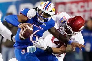 Kansas rallies, but Arkansas wins Liberty Bowl 55-53 in 3OTs