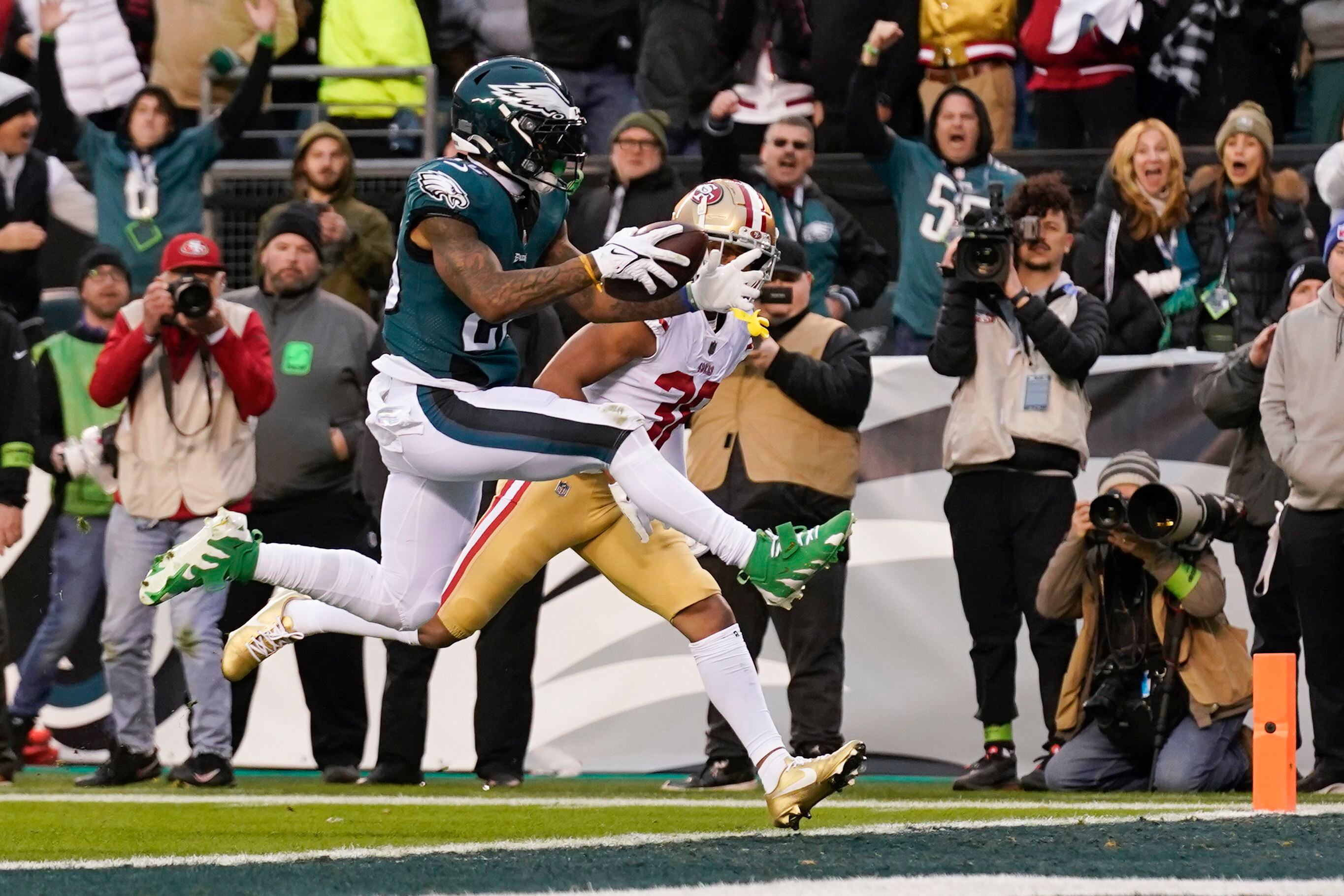 Jalen Hurts of the Philadelphia Eagles holds the George Halas